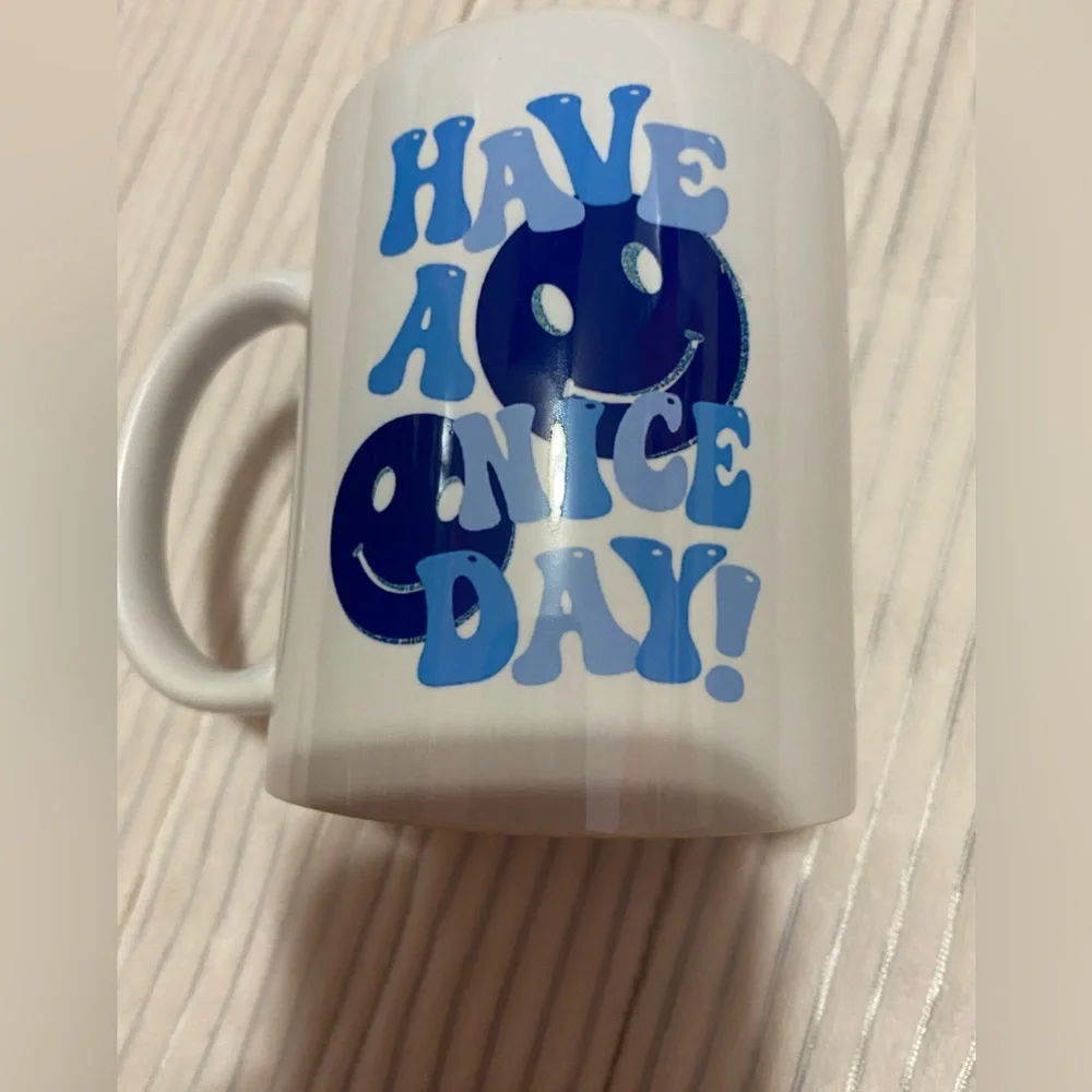 White and blue smiley face mug